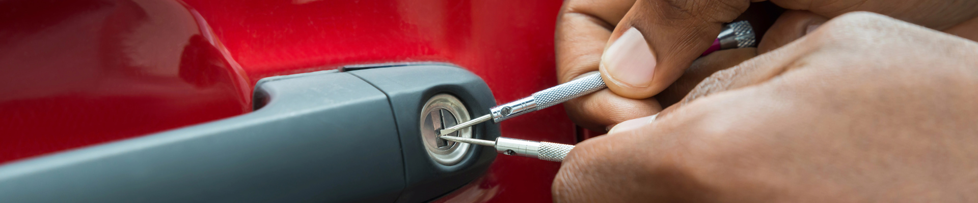 man using a phone during car lockout service