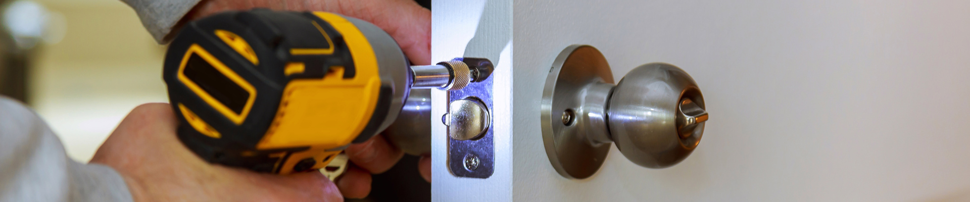 professional repairman adjusting door handle