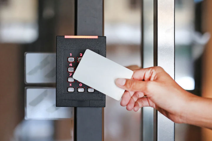 person holding phone with emergency locksmith contact